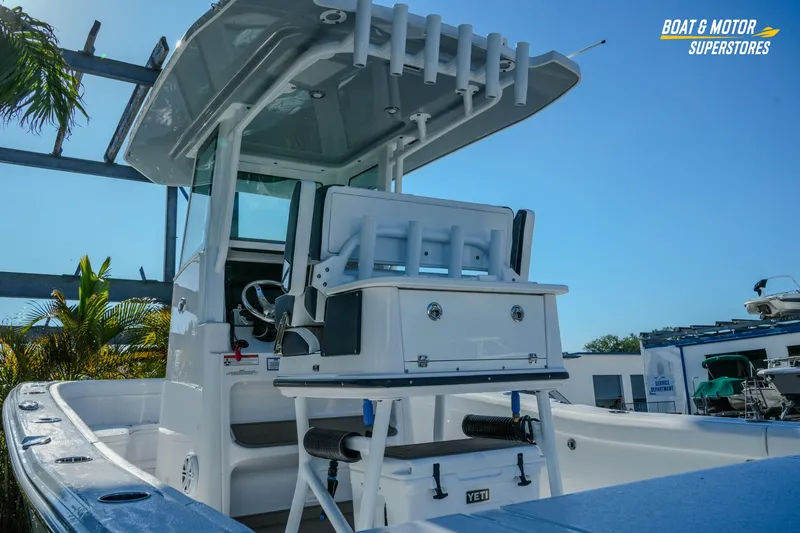 Slide: The Image of 2025 Blackfin 262 HB boat interior with helm station and rod holders. - 6