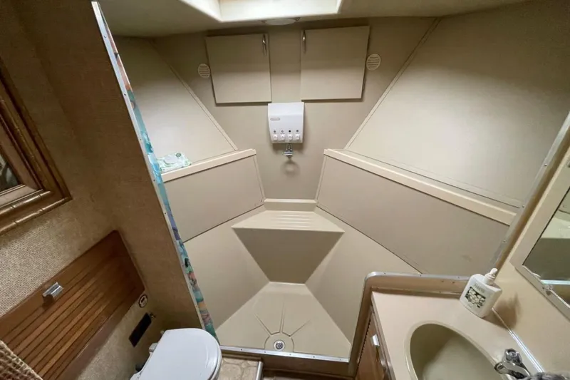 Slide: The Image of Bathroom interior of 1973 Chris-Craft 45 Commander yacht, featuring sink and toilet. - 12