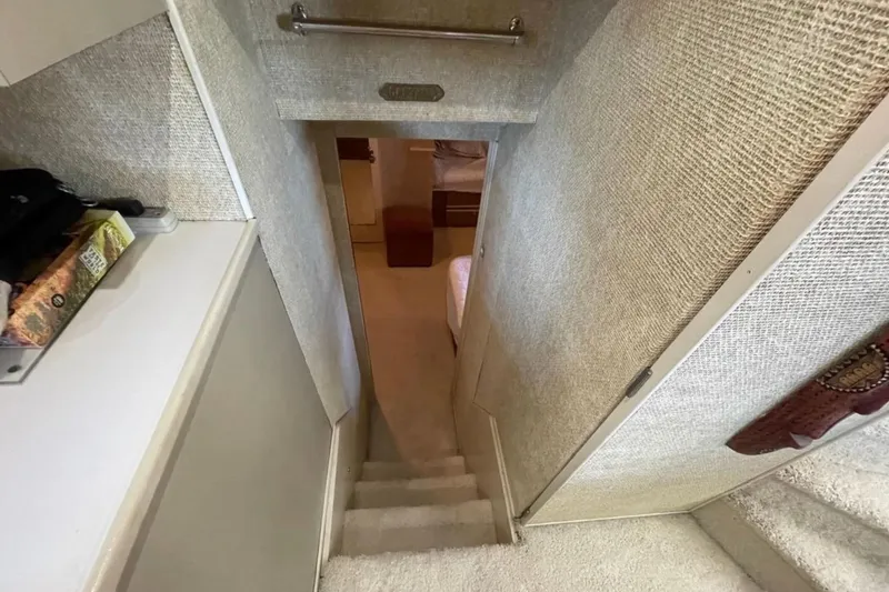 Slide: The Image of Interior view of 1973 Chris-Craft 45 Commander yacht, showing narrow staircase and cozy cabin. - 6