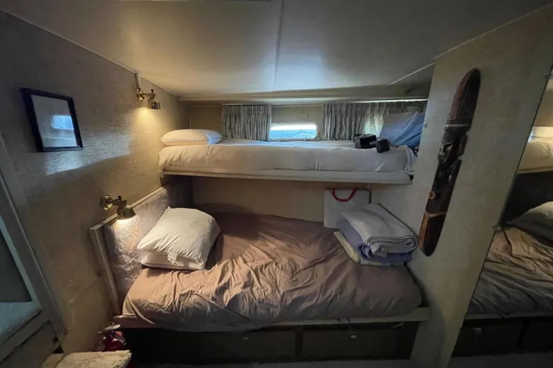 Slide: The Image of Cozy cabin interior of 1973 Chris-Craft 45 Commander with bunk beds and nautical decor. - 9