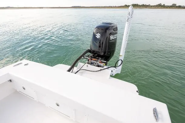 Slide: The Image of A 2026 Privateer ROAMER II boat with Suzuki outboard motor on calm water. - 5