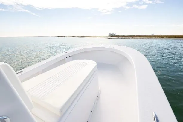Slide: The Image of Privateer ROAMER II 2026 boat on calm water, clear sky, and distant shoreline. - 6