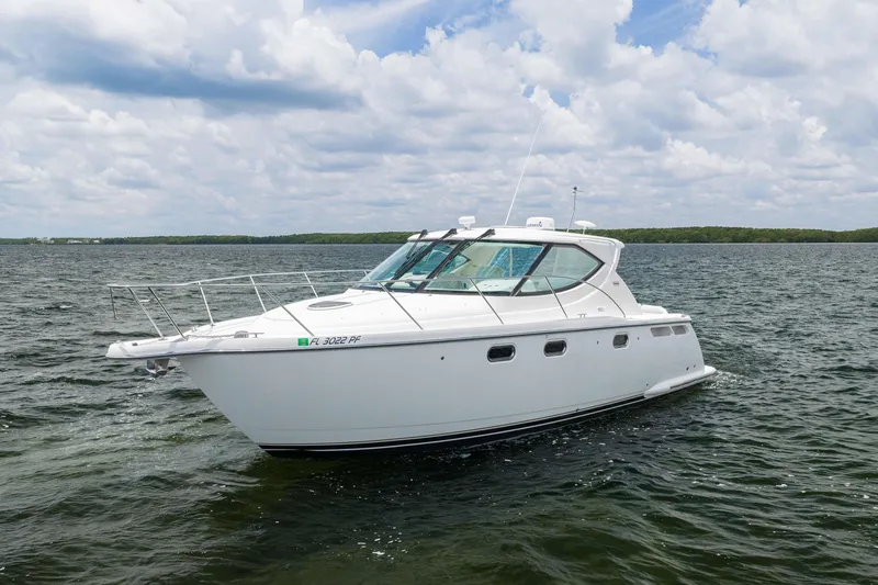 Slide: The Image of 2010 Tiara Yachts 3500 Sovran LE cruising on open water under cloudy skies. - 1