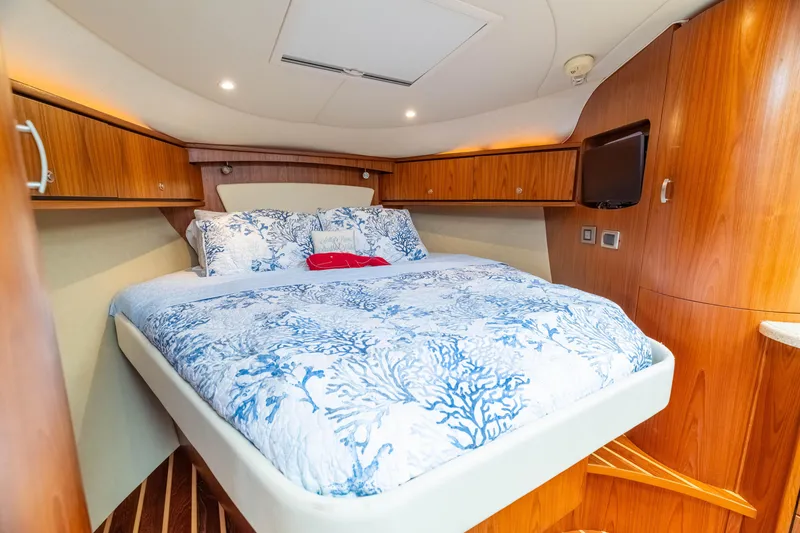 Slide: The Image of Luxurious cabin interior of 2010 Tiara Yachts 3500 Sovran LE with elegant wood finishes. - 40