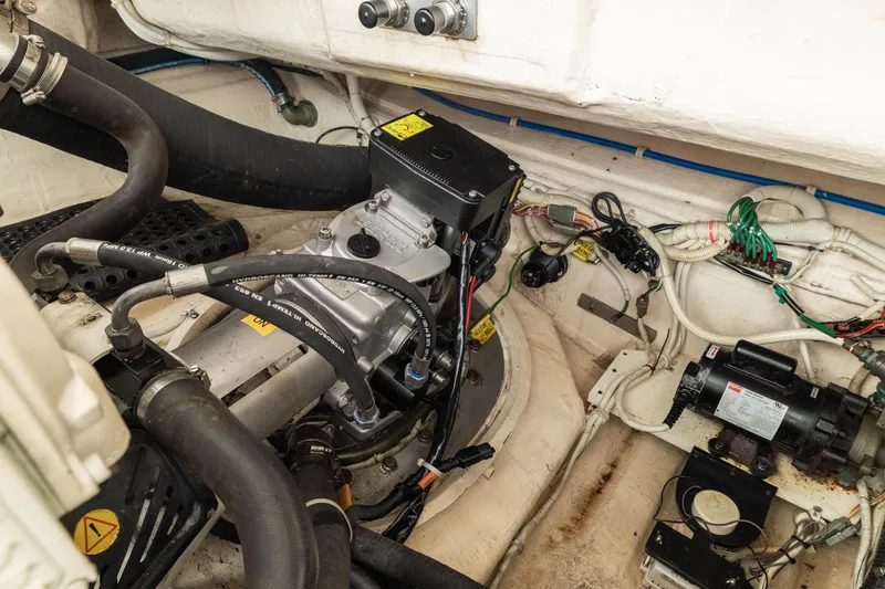 Slide: The Image of Engine room of 2010 Tiara Yachts 3500 Sovran LE, showcasing mechanical components and wiring. - 49