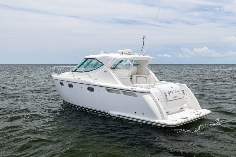 Slide: The Image of 2010 Tiara Yachts 3500 Sovran LE cruising on open water under a cloudy sky. - 6