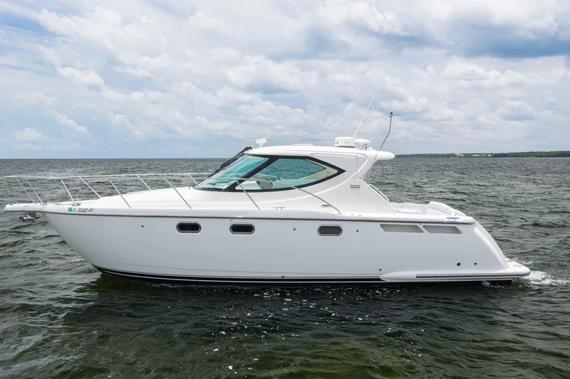 Slide: The Image of 2010 Tiara Yachts 3500 Sovran LE cruising on open water under cloudy skies. - 8