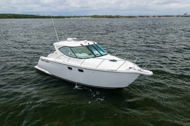 Slide: The Image of 2010 Tiara Yachts 3500 Sovran LE cruising on open water. - 9
