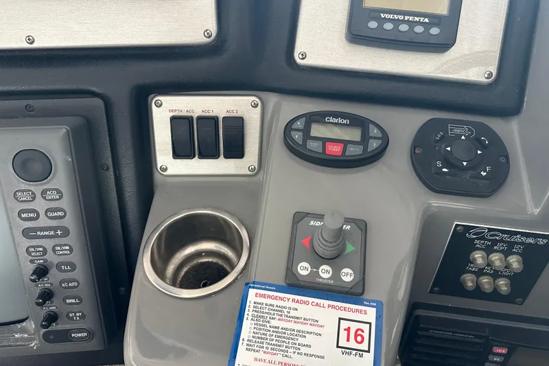 Slide: The Image of Control panel of a 2005 Cruisers Yachts 400 Express with various switches and displays. - 15