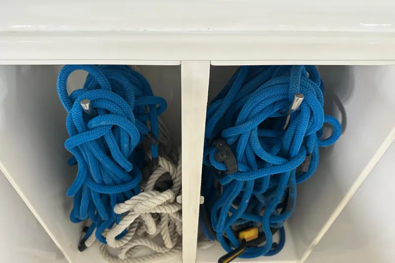 Slide: The Image of Blue and white ropes stored on a 2005 Cruisers Yachts 400 Express. - 20