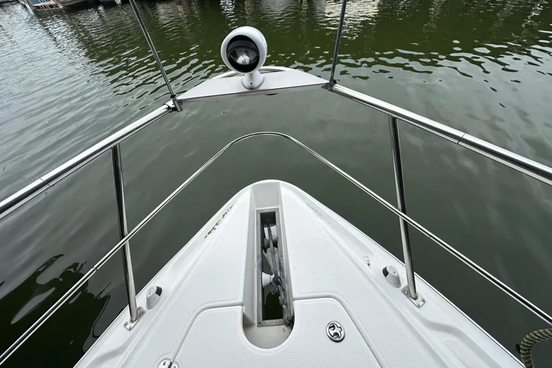 Slide: The Image of Bow view of 2005 Cruisers Yachts 400 Express on calm water. - 26