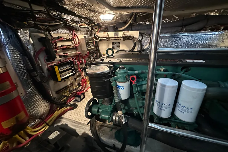 Slide: The Image of Engine room of 2005 Cruisers Yachts 400 Express with visible wiring and components. - 31