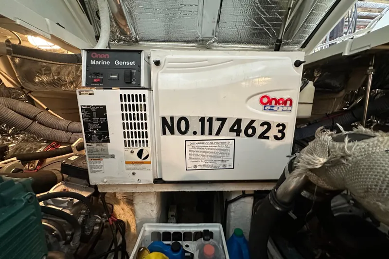 Slide: The Image of Onan marine generator inside 2005 Cruisers Yachts 400 Express engine room. - 32