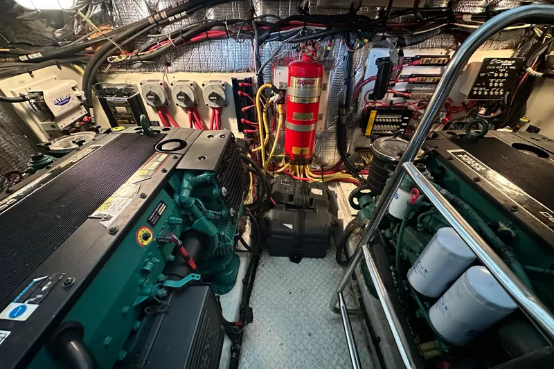 Slide: The Image of Engine room of 2005 Cruisers Yachts 400 Express with visible machinery and wiring. - 36