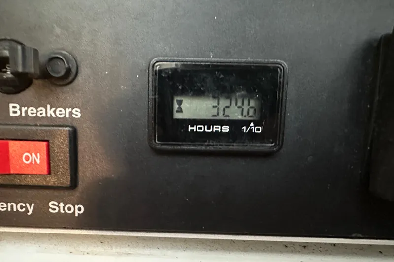 Slide: The Image of Hour meter reading 324.6 on 2005 Cruisers Yachts 400 Express control panel. - 37