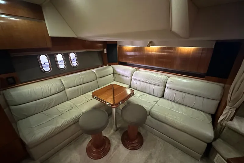 Slide: The Image of Luxurious interior of 2005 Cruisers Yachts 400 Express with leather seating and wooden accents. - 40