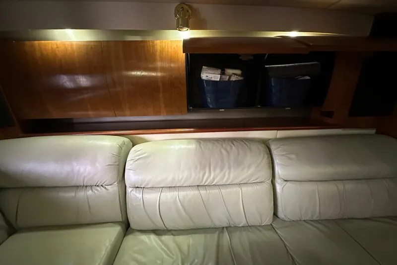 Slide: The Image of Interior of 2005 Cruisers Yachts 400 Express with leather seating and wooden accents. - 44