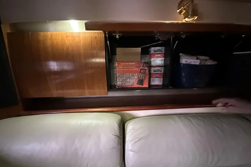 Slide: The Image of Interior storage of 2005 Cruisers Yachts 400 Express with marine equipment and supplies. - 45