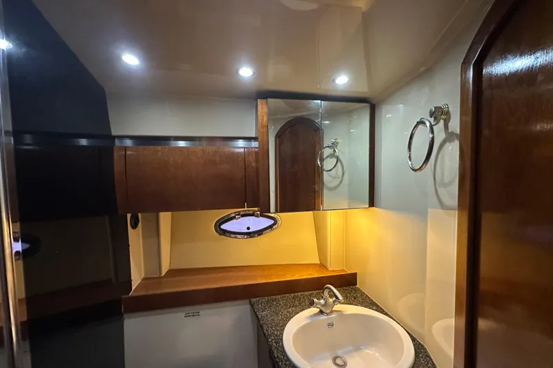 Slide: The Image of Luxurious bathroom interior of 2005 Cruisers Yachts 400 Express with modern fixtures. - 49