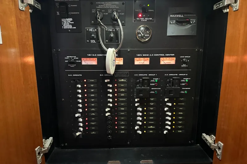 Slide: The Image of Electrical control panel of a 2005 Cruisers Yachts 400 Express boat. - 56