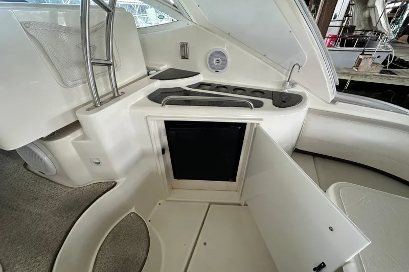 Slide: The Image of 2005 Cruisers Yachts 400 Express interior with open storage and sleek design. - 9