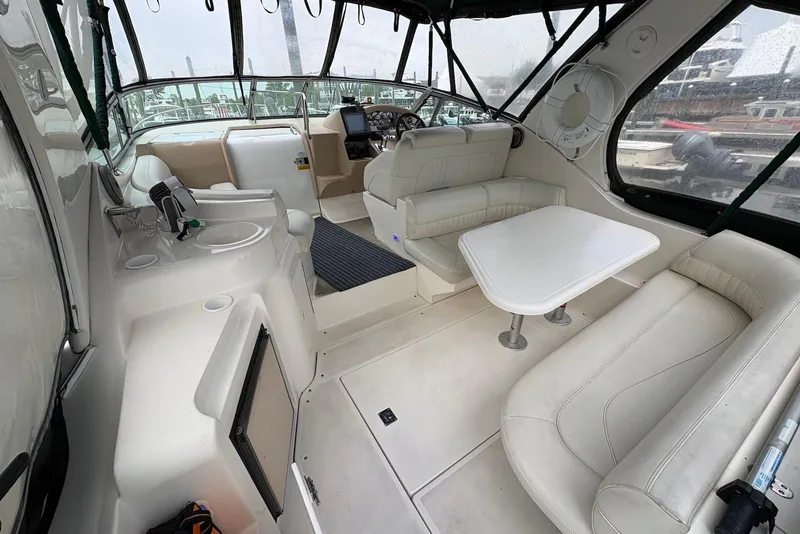 Slide: The Image of Interior of 1999 Cruisers Yachts 3375 Esprit with seating and helm station. - 5
