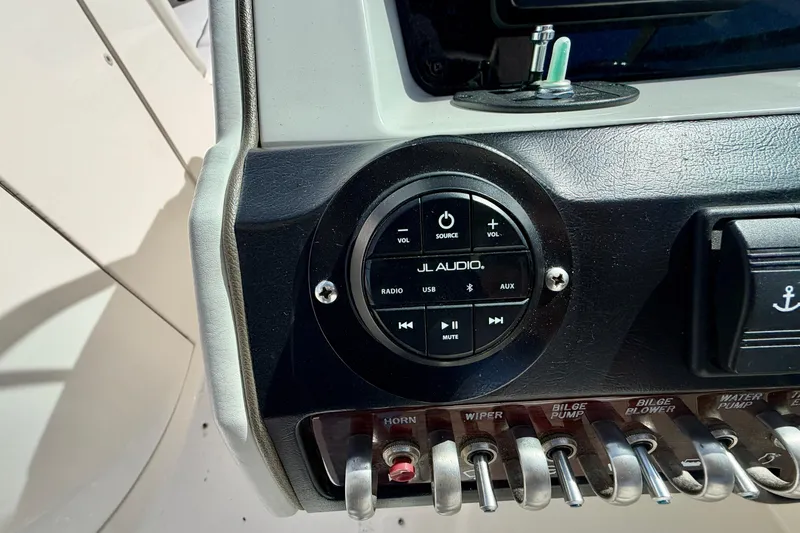 Slide: The Image of Control panel of a 2008 Sea Ray 300 SLX boat featuring JL Audio system. - 12