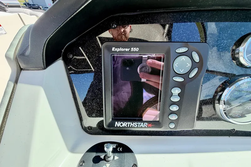 Slide: The Image of Northstar Explorer 550 on 2008 Sea Ray 300 SLX dashboard, reflecting surroundings. - 13