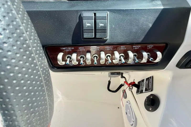 Slide: The Image of Control panel of a 2008 Sea Ray 300 SLX boat with labeled switches. - 15