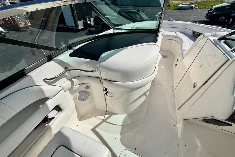 Slide: The Image of 2008 Sea Ray 300 SLX boat interior with white seating and sleek design. - 18