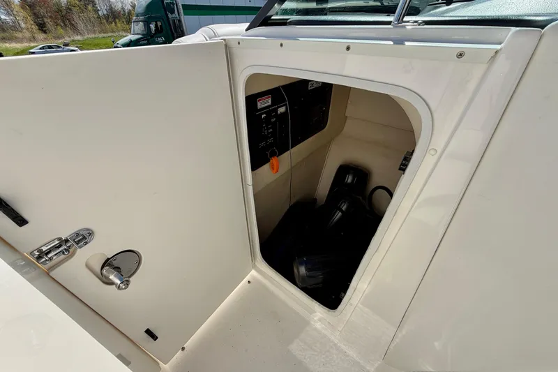 Slide: The Image of Storage compartment on a 2008 Sea Ray 300 SLX boat, showing interior equipment. - 20
