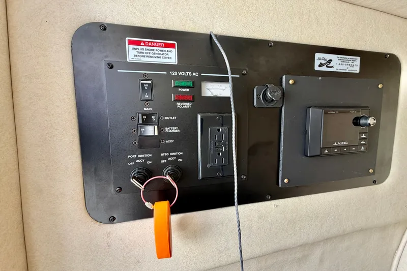 Slide: The Image of Control panel of a 2008 Sea Ray 300 SLX boat with electrical switches. - 21