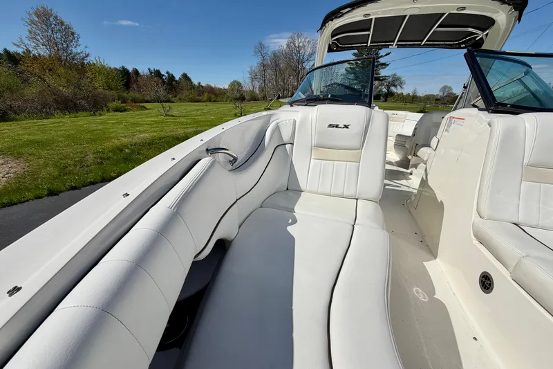Slide: The Image of Interior view of a 2008 Sea Ray 300 SLX boat with white seating. - 24