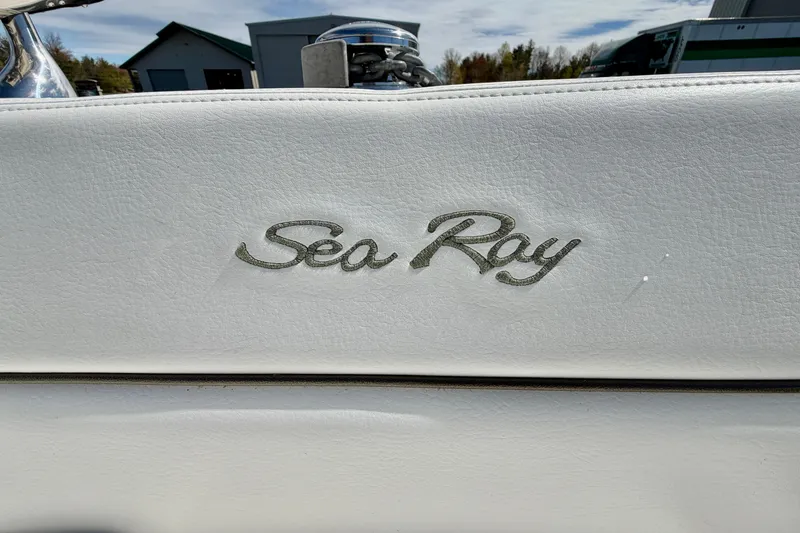 Slide: The Image of Sea Ray logo on 2008 Sea Ray 300 SLX boat, white leather background. - 27