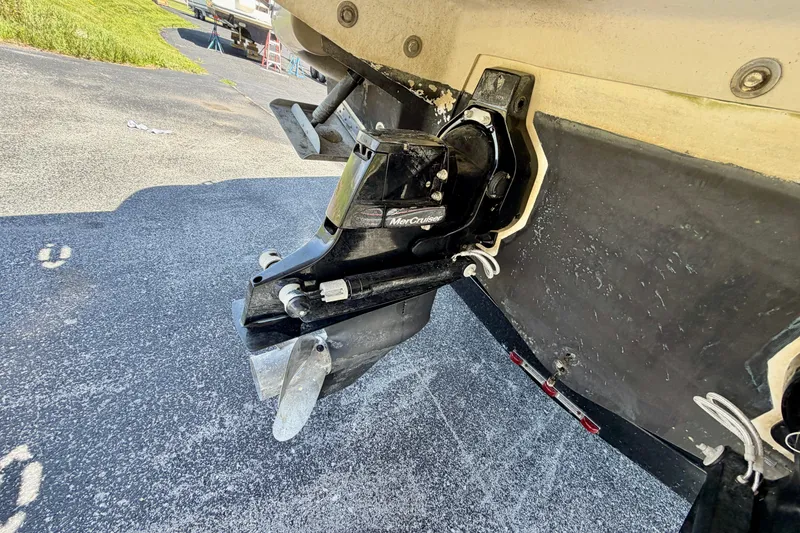 Slide: The Image of 2008 Sea Ray 300 SLX boat with MerCruiser outdrive on asphalt surface. - 31