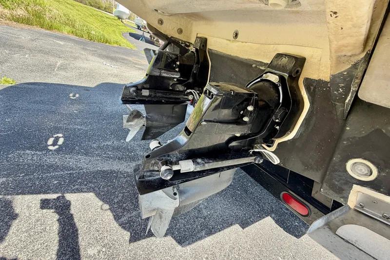 Slide: The Image of 2008 Sea Ray 300 SLX boat stern drive components on a paved surface. - 32