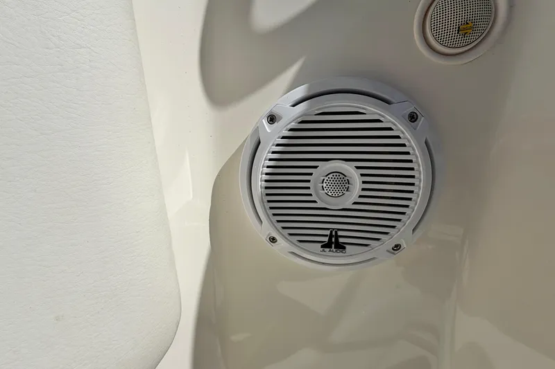 Slide: The Image of White JL Audio speaker on 2008 Sea Ray 300 SLX boat interior. - 35