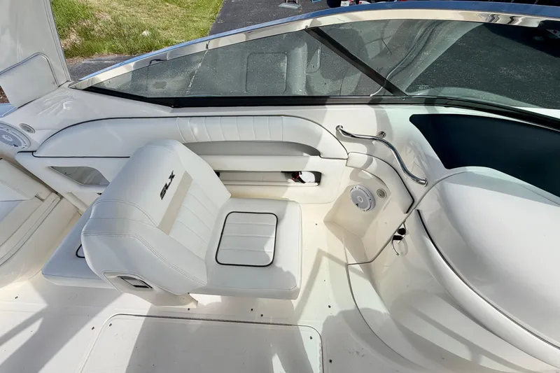 Slide: The Image of Interior of 2008 Sea Ray 300 SLX boat with white seating and sleek design. - 7