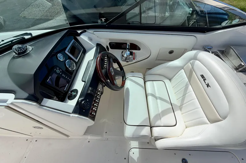 Slide: The Image of Cockpit of 2008 Sea Ray 300 SLX with white leather seating and modern controls. - 9
