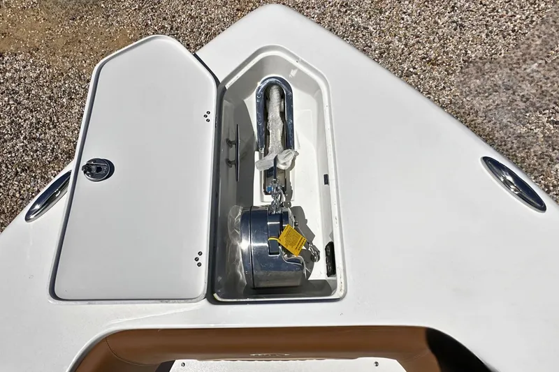 Slide: The Image of Anchor compartment of 2026 Key West 291 FS boat, featuring a secure storage hatch. - 21