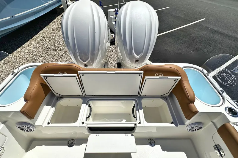 Slide: The Image of 2026 Key West 291 FS boat interior with storage compartments and twin engines. - 5
