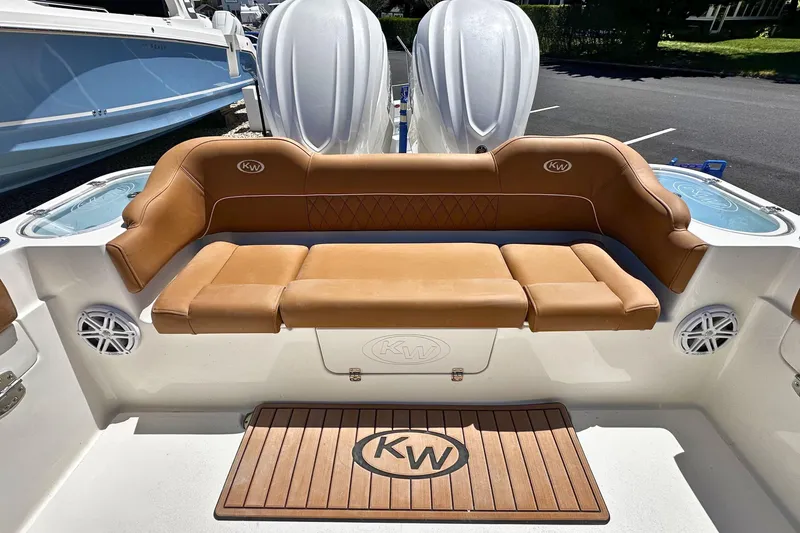 Slide: The Image of 2026 Key West 291 FS boat with tan seating and dual engines. - 6