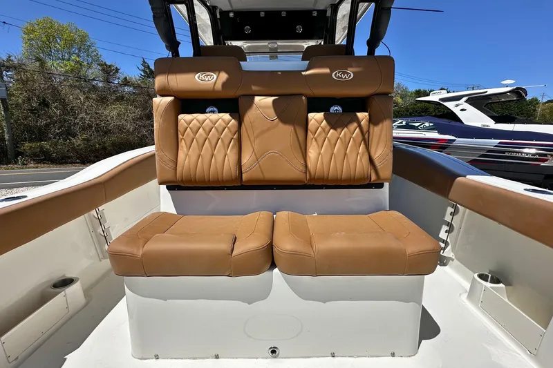 Slide: The Image of 2026 Key West 291 FS boat interior with tan leather seating and sleek design. - 7