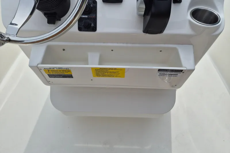 Slide: The Image of Console of 2026 Key West 189 FS boat with steering wheel and controls. - 10