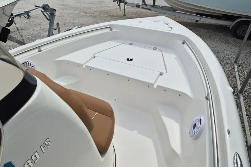 Slide: The Image of 2026 Key West 189 FS boat interior with seating and storage compartments. - 13