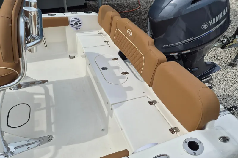 Slide: The Image of 2026 Key West 189 FS boat interior with tan seating and Yamaha engine. - 5