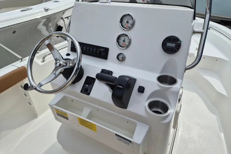 Slide: The Image of Steering console of 2026 Key West 189 FS boat with gauges and controls. - 9
