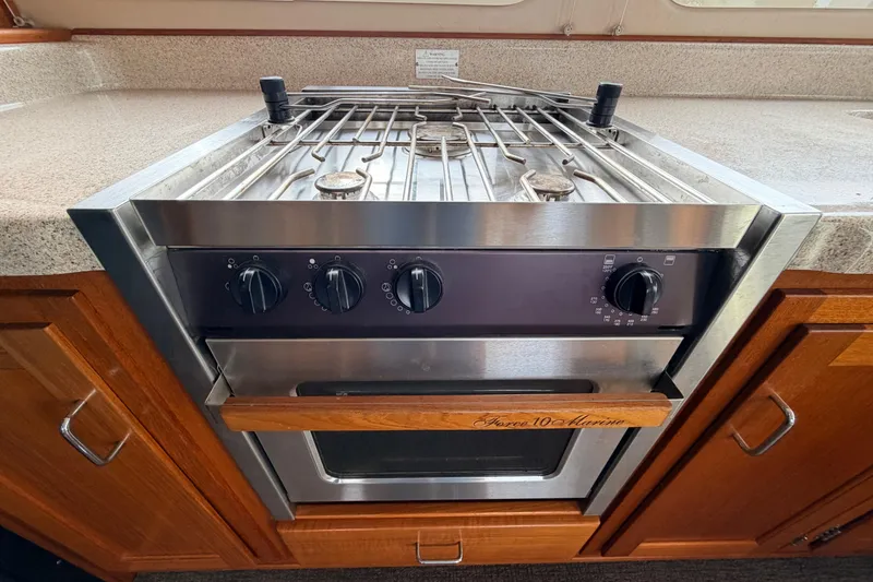 Slide: The Image of Stainless steel marine stove and oven in 2002 American Tug 34 yacht kitchen. - 12