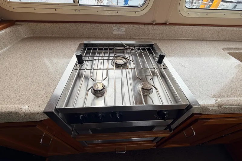Slide: The Image of Stainless steel stove in 2002 American Tug 34 boat kitchen interior. - 13