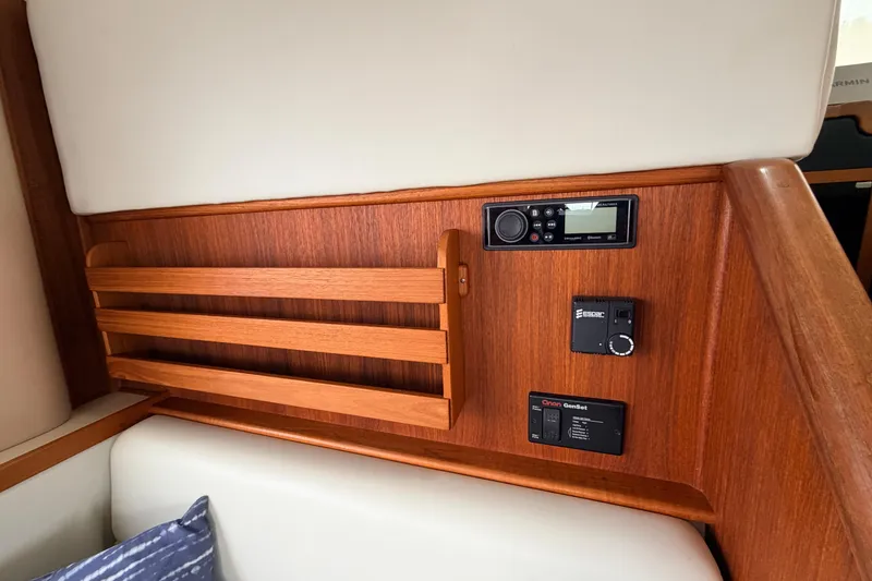 Slide: The Image of Interior of 2002 American Tug 34 featuring wooden paneling and control systems. - 19